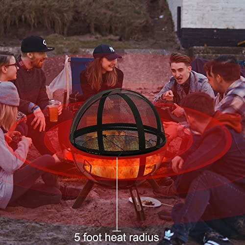 Group of friends sitting around a fire pit on the beach.