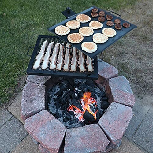 Cooking bacon, pancakes, and sausages over a campfire.