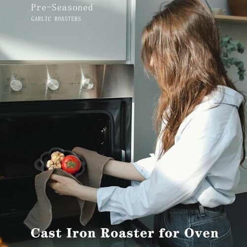 Woman placing cast iron roaster with vegetables in oven.