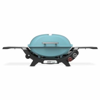 Compact portable gas grill with blue lid and black base.