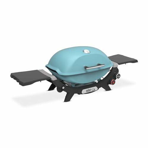 Compact portable gas grill with blue lid and side shelves