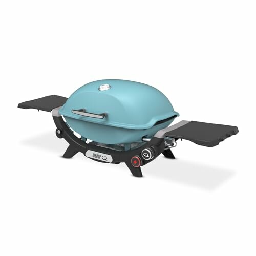 Portable gas grill with blue lid and side tables