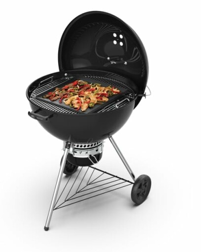 Kettle-style charcoal grill with lid open