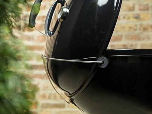 Close-up of black kettle grill with open lid