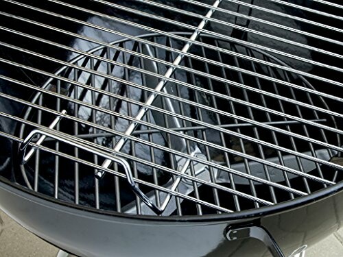 Close-up of a charcoal grill with a metal grate.