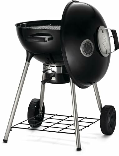 Black charcoal grill with lid and wheels.