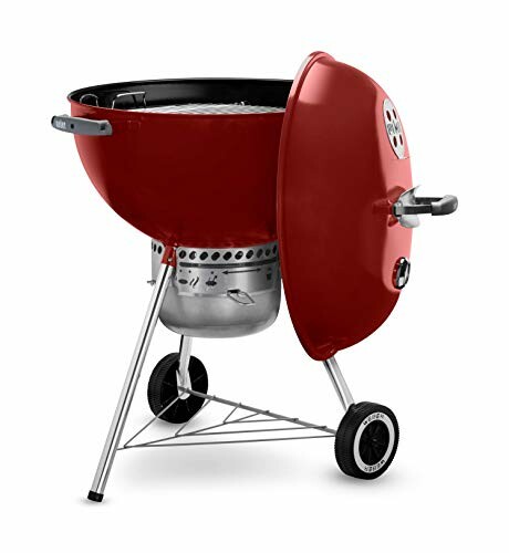 Red charcoal grill with wheels and lid