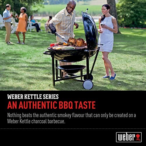 People enjoying a barbecue with a Weber Kettle grill outdoors.